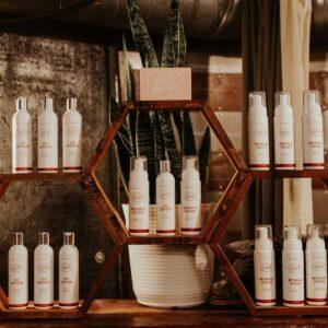 Wall of tanning mousse at OATS SLO tanning & airbrush salon