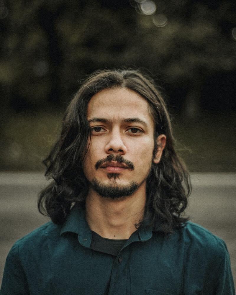 Man with long hair and stylish mustache