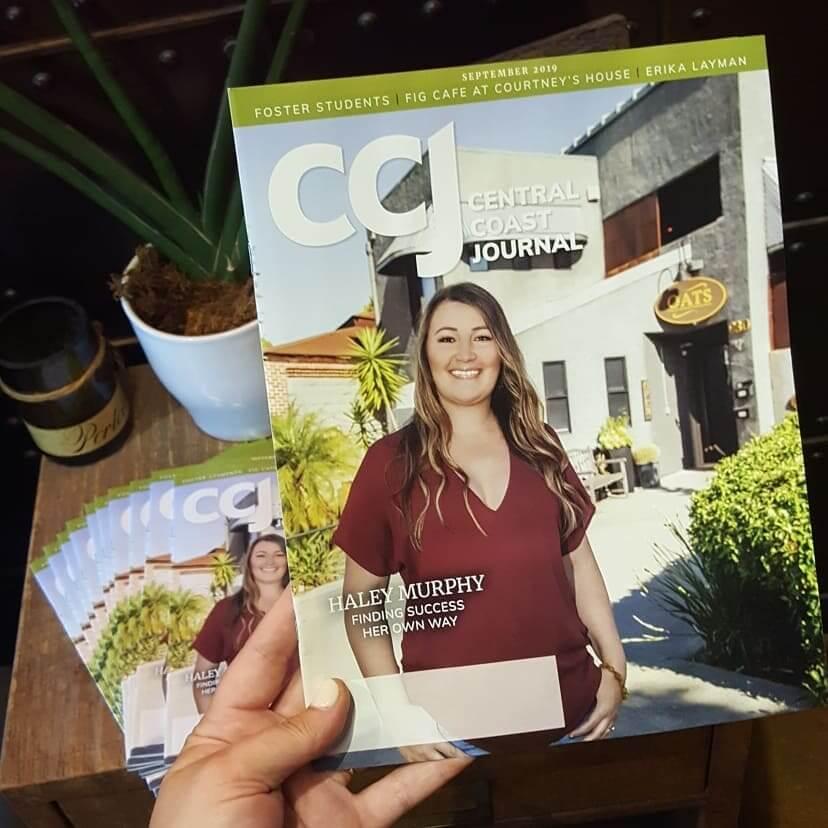 Woman being spray tanned at OATS SLO tanning & airbrush Salon