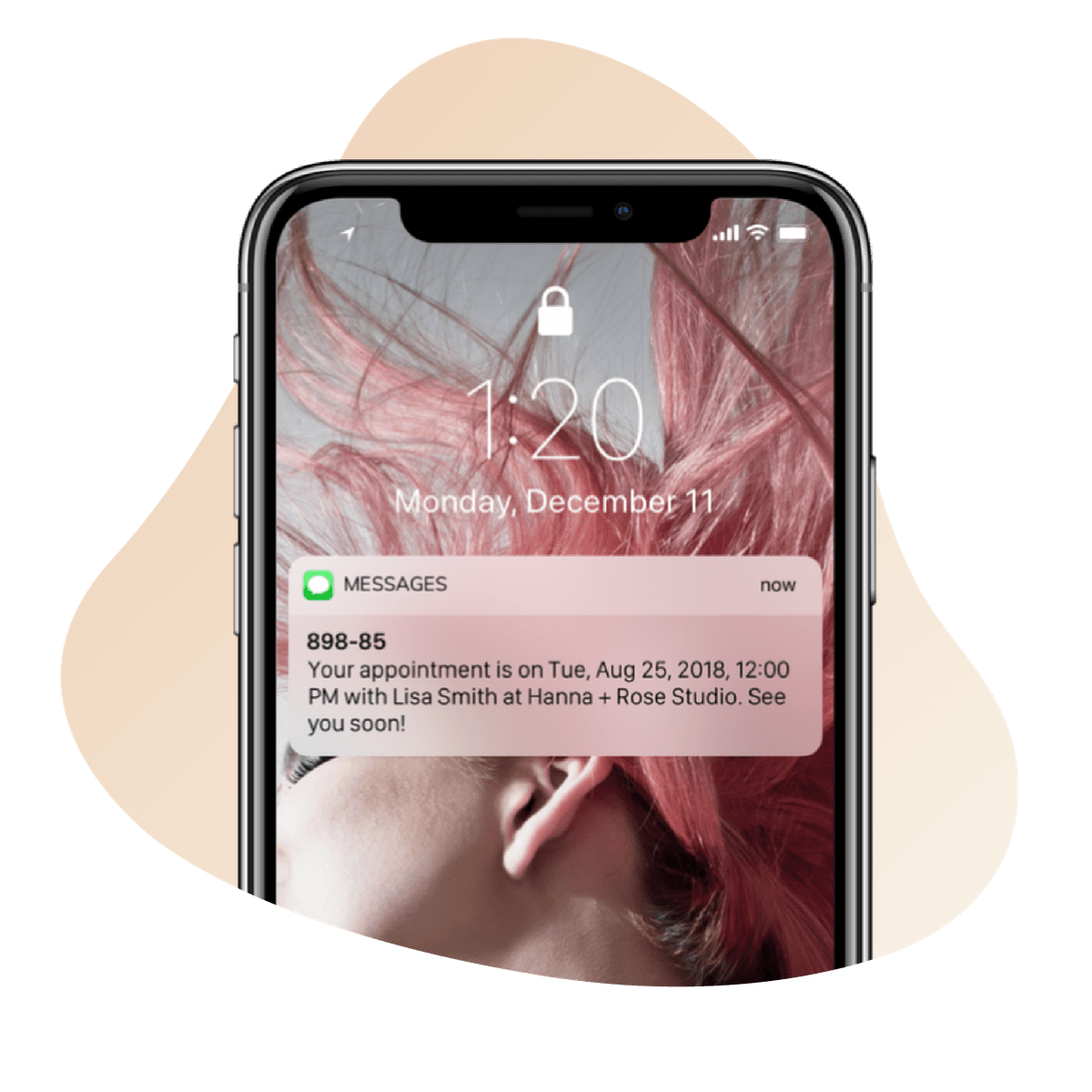 A phone showing customer text notification from Vagaro appointment reminder software