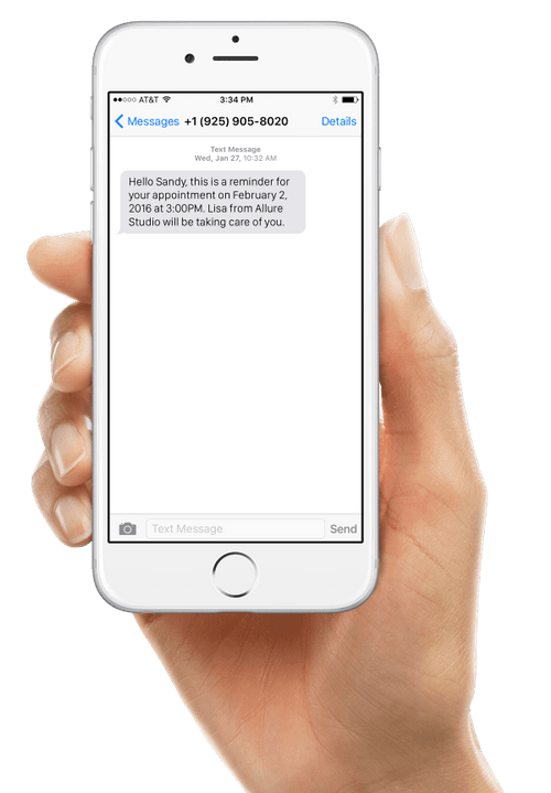 A phone showing customer text notification from Vagaro appointment reminder software