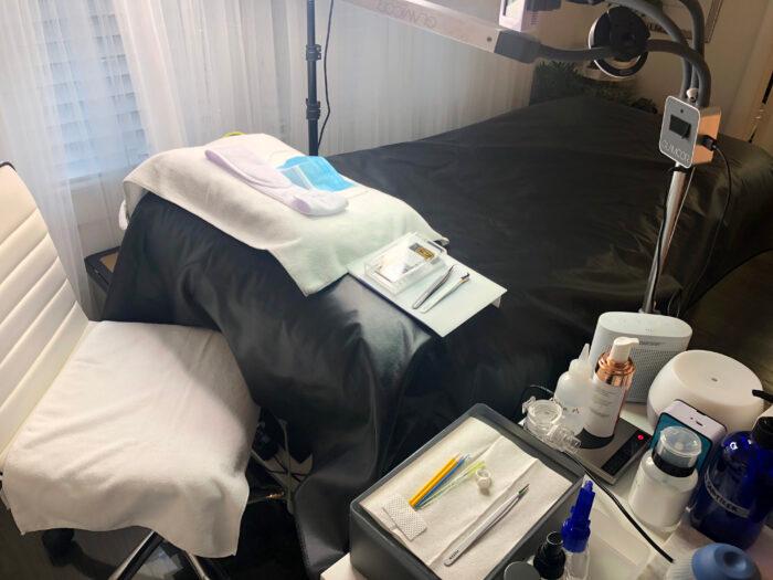 bed with vinyl pad and tools on a tray