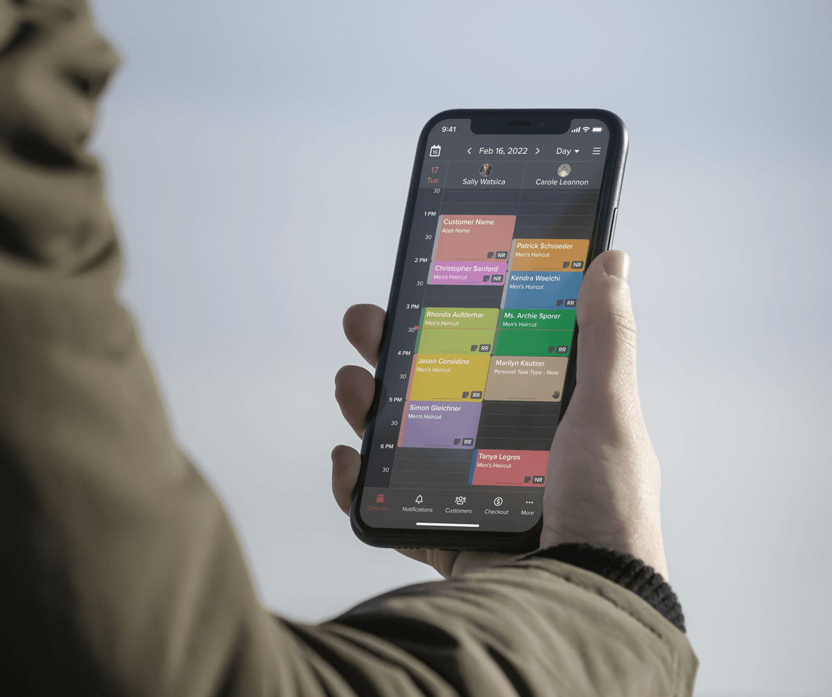 closeup of barber software in dark mode on mobile phone