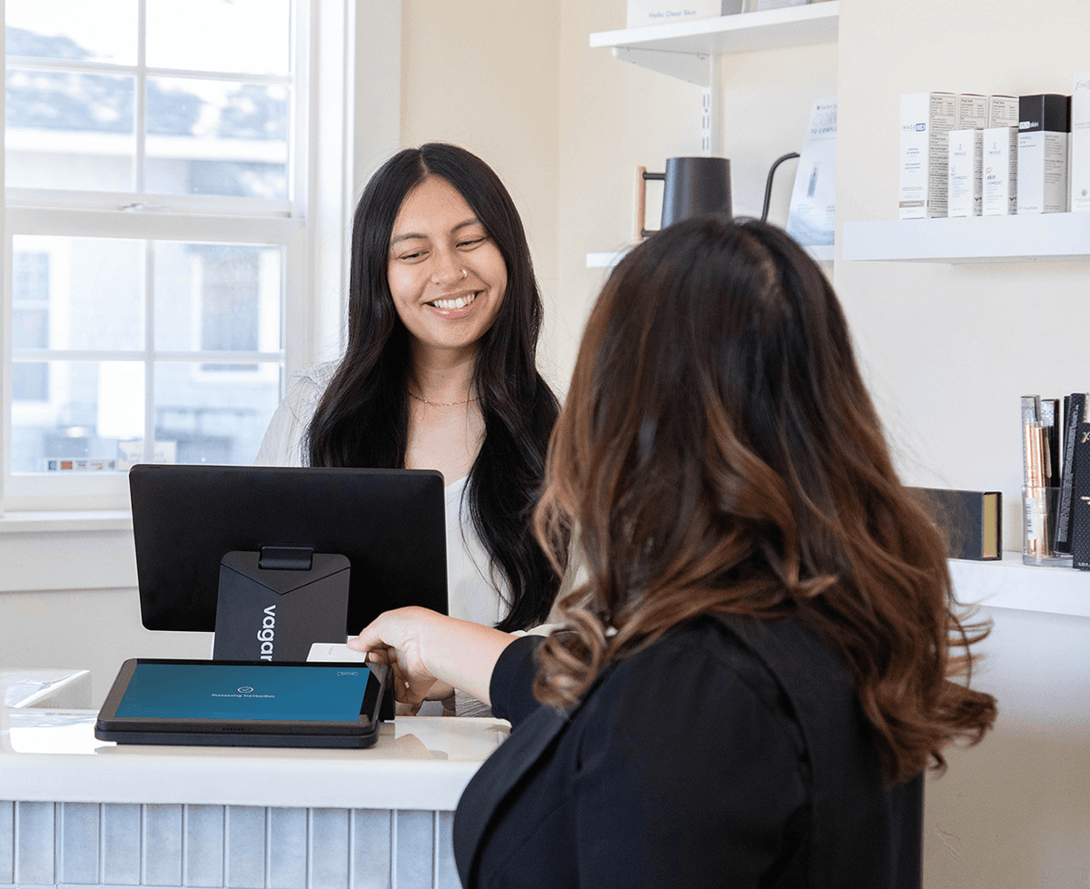 fitness client completing checkout by apple pay on a dual touchscreen point of sale system