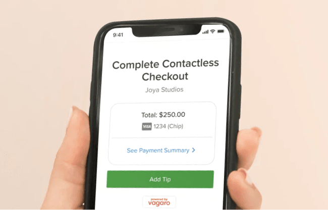 Tablet with online booking system showing rules requiring deposits for booking services.