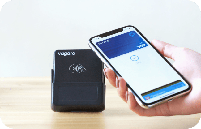 A person using Apple pay on nail salon POS card reader.